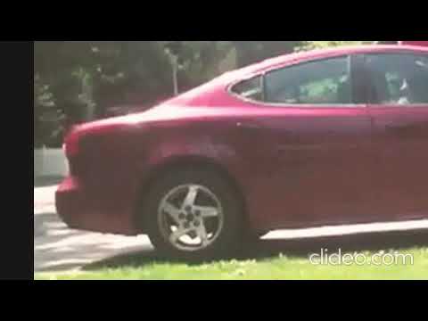 Girl weighing down car – zoomed