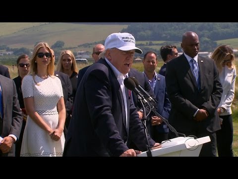 Protester greets Donald Trump at Scottish golf course